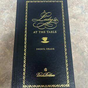 "A Lady at the Table" book of manners, blue leather with gold lettering, NWT